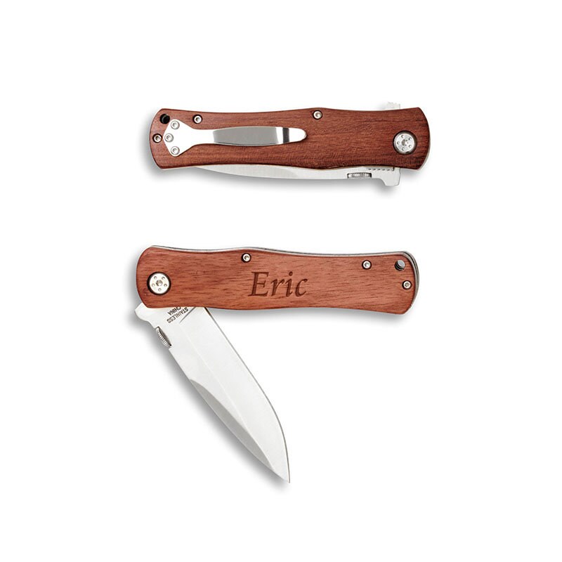 Wooden-handled folding knife with 'Eric' engraving on a white background