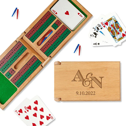 Folding cribbage board engraved with a couple's initial that have a striped font - year is included in the design.